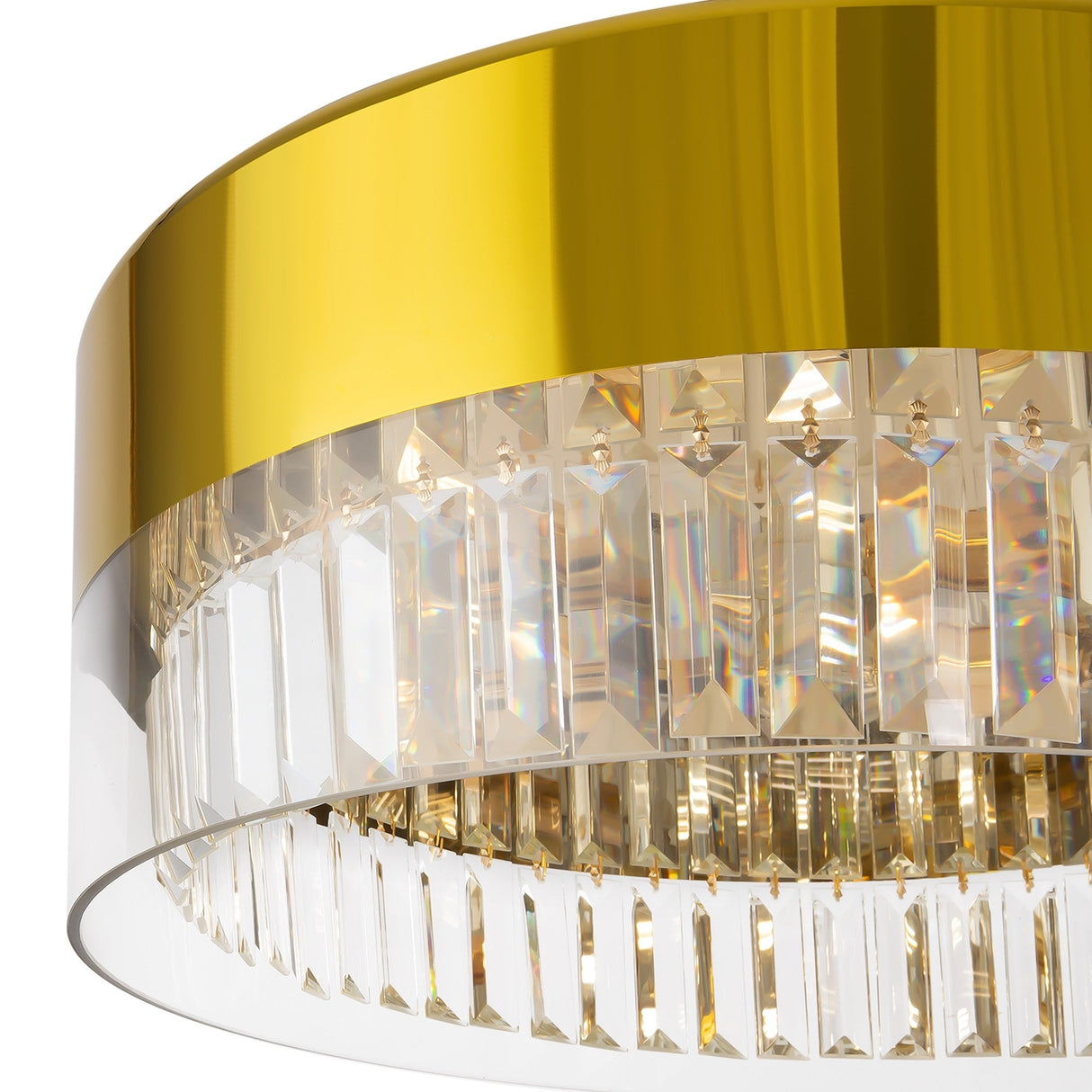 A close-up of the Wonderland 6 Light Chandelier - Gold, featuring a reflective gold band and crystal pendants. The light refracts through the crystals, displaying a spectrum of colors.