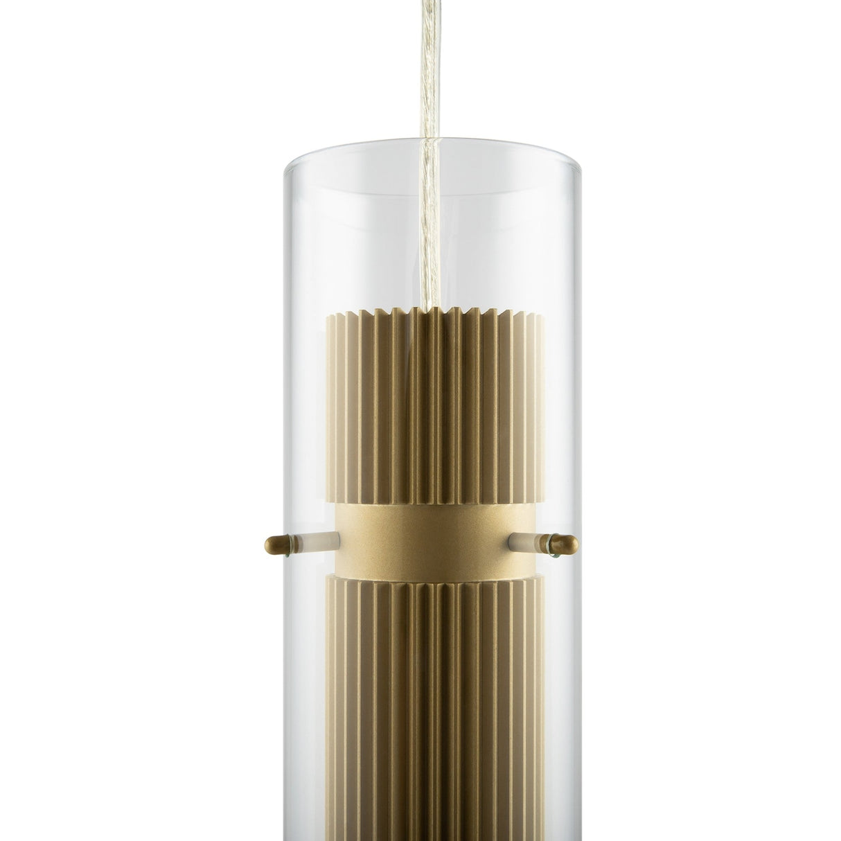 The Dynamics Pendant Light - Gold With Outer Clear Glass features a sleek cylindrical design with a ribbed brass interior and gold finish. A cord elegantly suspends the fixture, capturing modern lightings essence through its clear glass, highlighting the metallic texture within.