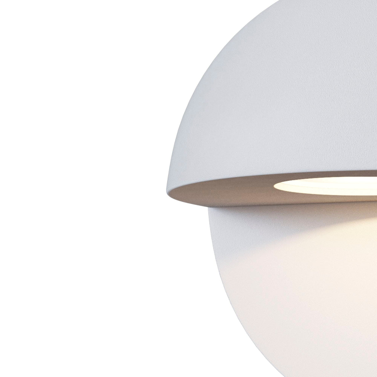 The Mezzo Outdoor LED Wall Light 3000K – White features a semi-circular white shade and durable aluminum construction. Its minimalist design, with smooth curves and a matte finish, emits a warm white glow that gently illuminates the wall behind.