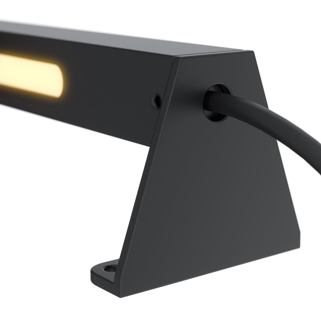 The Edge Outdoor Landscape LED Ground Light in black features a modern triangular base, emits a warm glow ideal for outdoor lighting, and includes a right-side black cable. This energy-efficient fixture is weather-resistant for lasting durability.