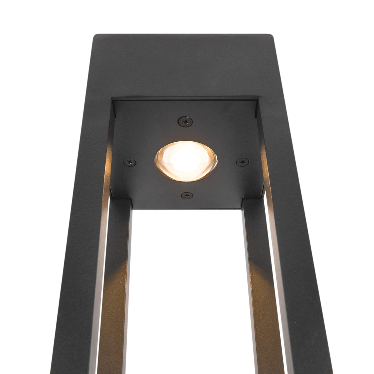 Close-up of the Elbe Bollard Light 200cm - Graphite, a modern outdoor fixture with a black metal frame. It has a central circular bulb emitting a warm glow, framed by a geometric design in sleek graphite, set against a white background.