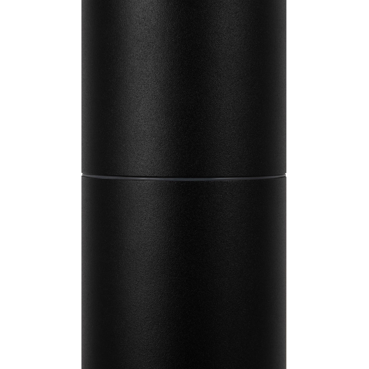 A tall, cylindrical matte black object resembling the Koln LED Bollard Light 65cm - Black. Its smooth surface with a faint horizontal seam suggests a detachable top for accessing the LED module. Set against a plain white background, it hints at sophisticated outdoor lighting.