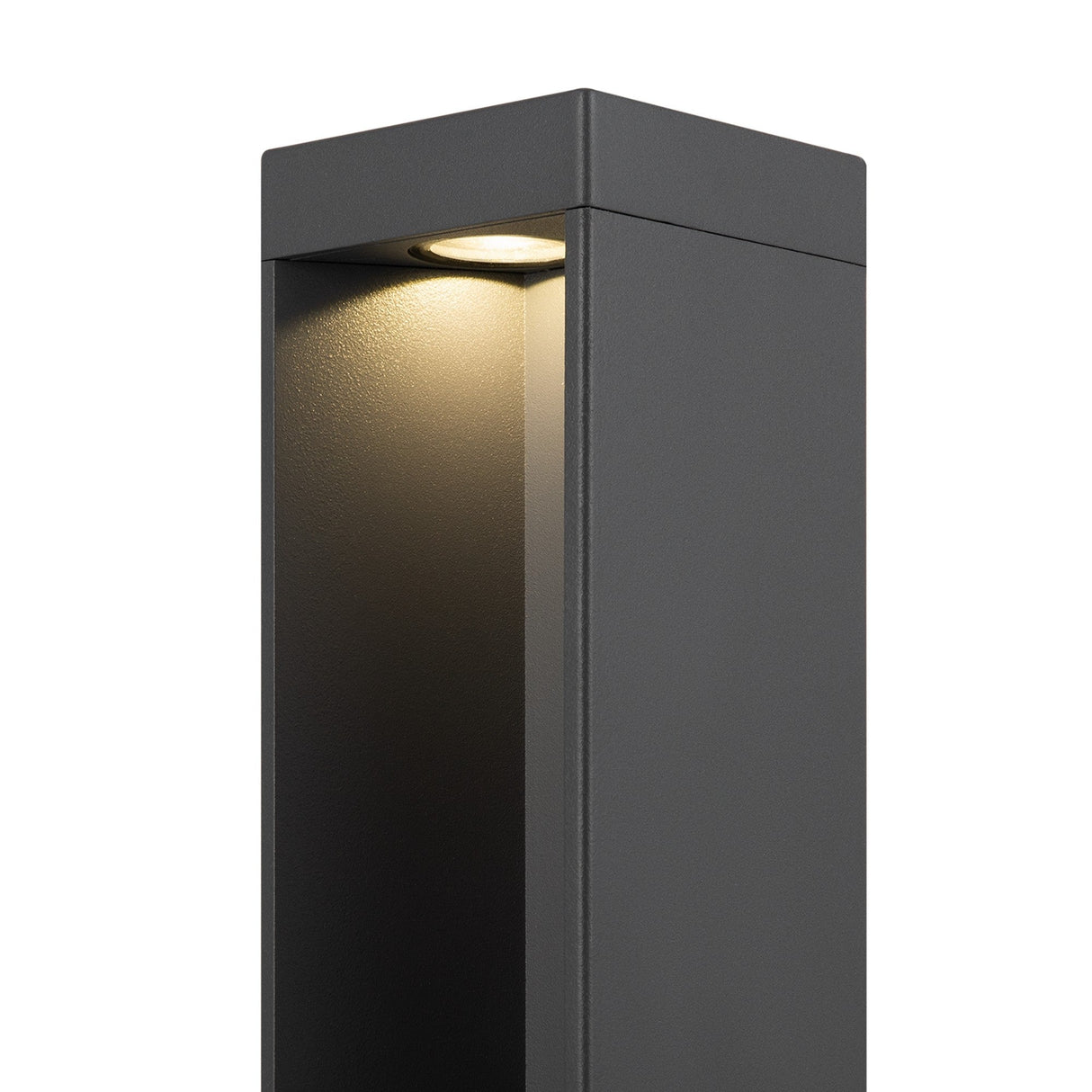 The Essen LED Bollard Light 65cm in grey is a modern rectangular outdoor fixture with a sleek finish. It emits a soft glow from its top recessed LED, illuminating surfaces below while highlighting its corrosion-resistant design.