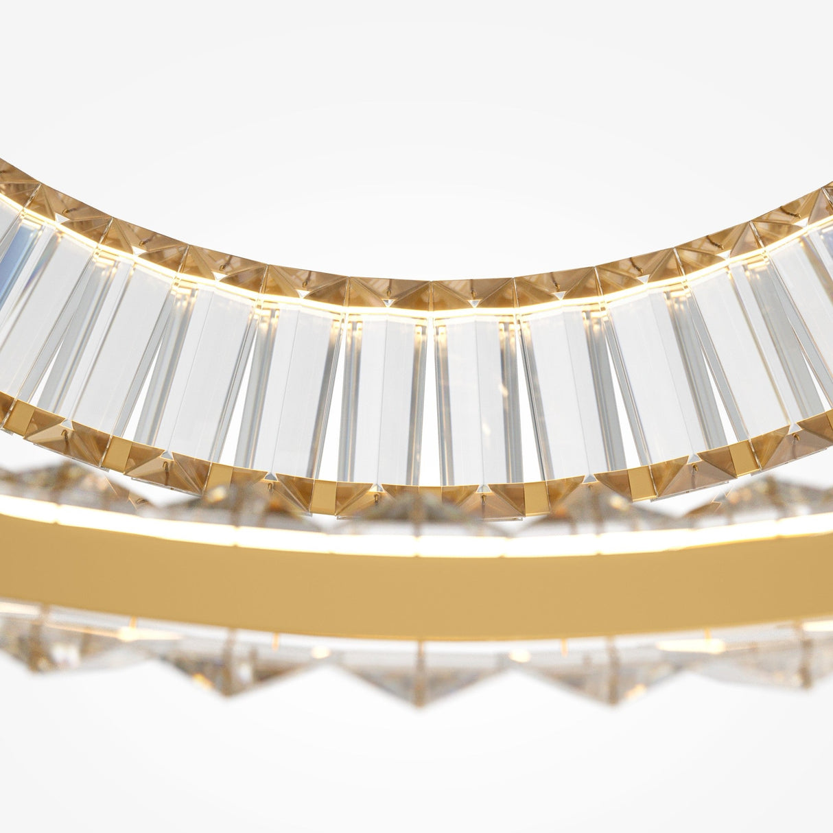 A close-up of the Krone 2 Tier LED Circular Crystal Suspension Light - Gold reveals transparent, elongated crystal facets bordered by a gold band. The gracefully curved piece embodies modern luxury with its reflective, elegant design.