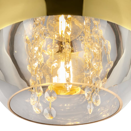 The Fermi Small Dome Pendant Light showcases an elegant and modern design with crystal accents and a glowing bulb encased in shiny gold, resembling a chandelier that brings luxurious warmth to any space.