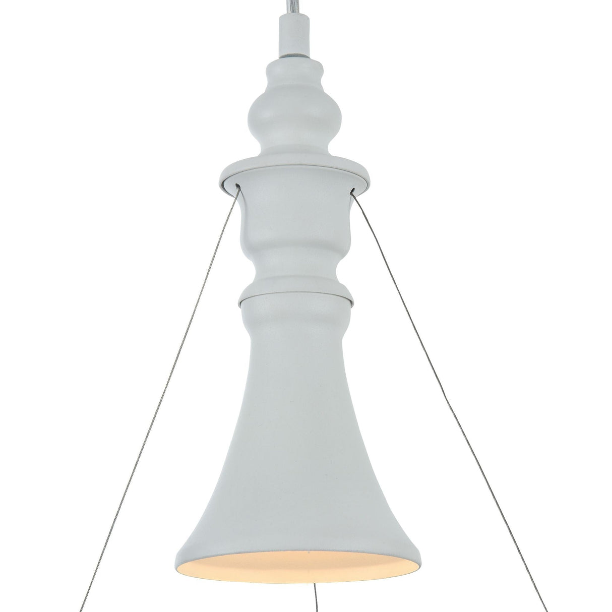 The Elva Single Pendant Light - White boasts a modern chess piece design, hanging gracefully from the ceiling with thin wires. Its wide, flared bottom includes a decorative diffuser that casts a soft, warm glow.