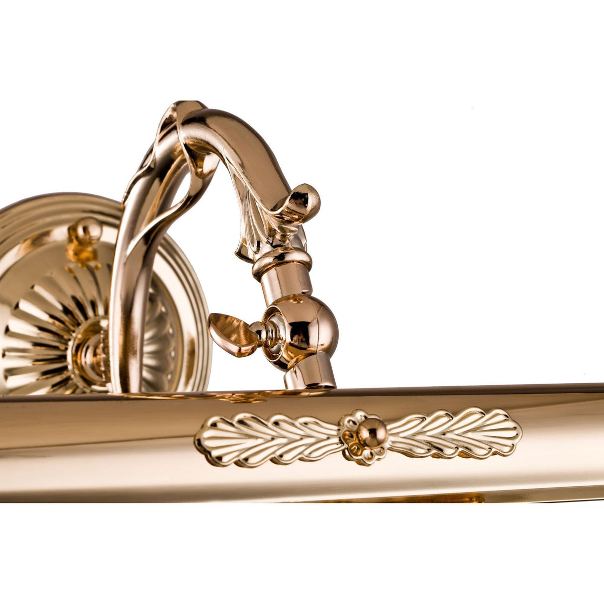 The Picasso Classic Picture Light - Gold showcases an ornate, polished design with intricate floral detailing. Its adjustable backlight has a curved arm and a circular wall mount featuring a classic rosette base, all set against a white background to exude timeless elegance.