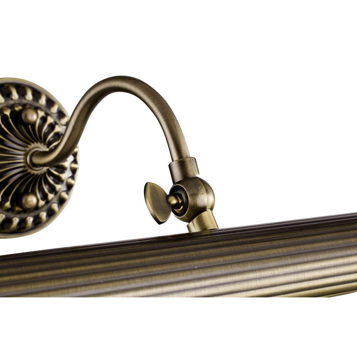 A close-up shows a decorative bronze wall-mounted light fixture with an ornate fan-shaped backplate and curved arm, reminiscent of the Renoir Classic Picture Light - Bronze. Its ridged surface adds texture and elegance.