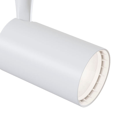 A close-up of the Vuoro LED Single Phase Unity Track Spotlight 6W 3000K in white. The smooth, cylindrical spotlight is turned off, revealing its circular interior and adjustable swivel mechanism on a straight white arm against a plain white background, highlighting its sleek design.