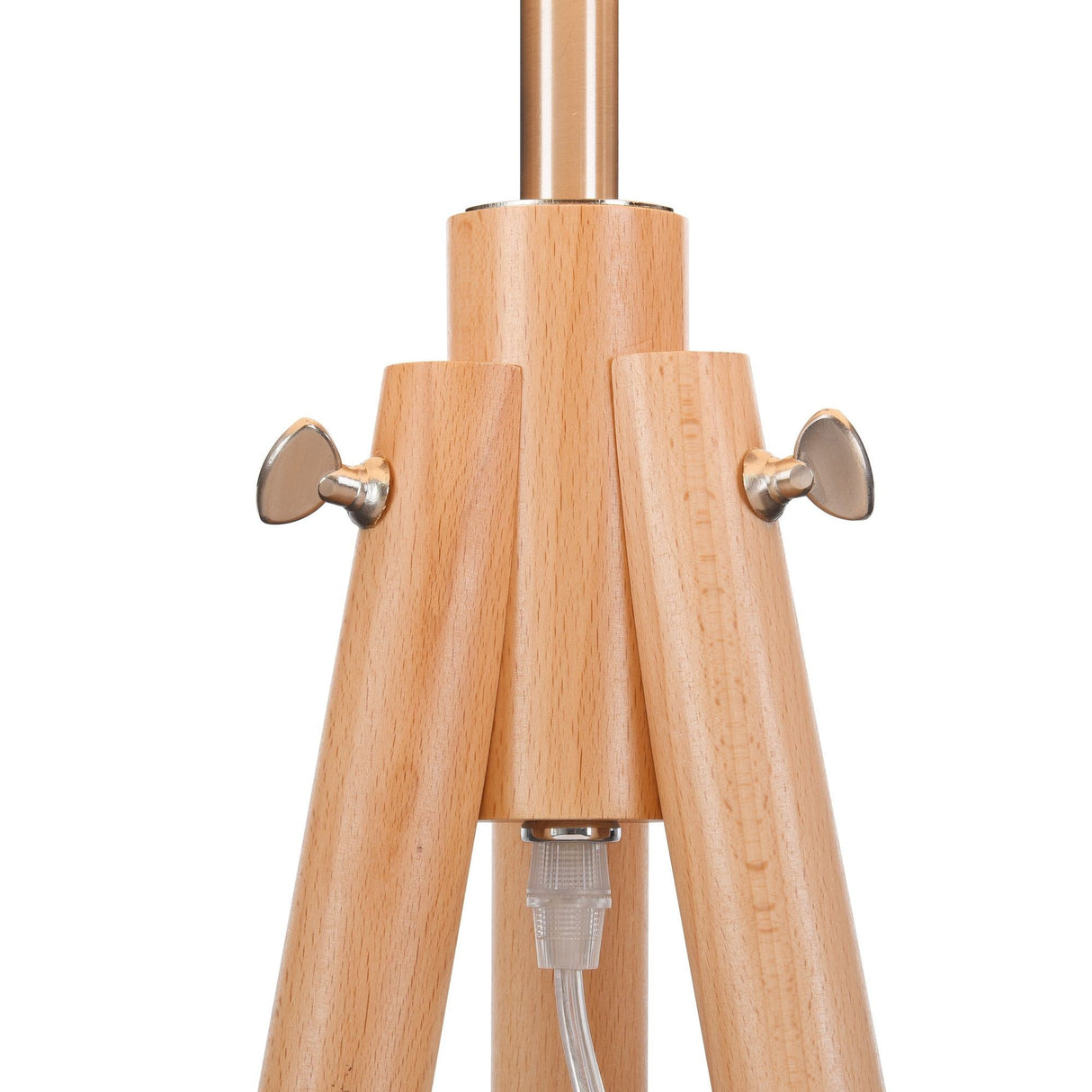 Close-up of the Calvin Floor Lamp - Beige With Natural Wood Tripods wooden base, featuring silver wingnuts for tightening. Its minimalist design showcases a natural finish on light wood, and the power cord is visible from the center.