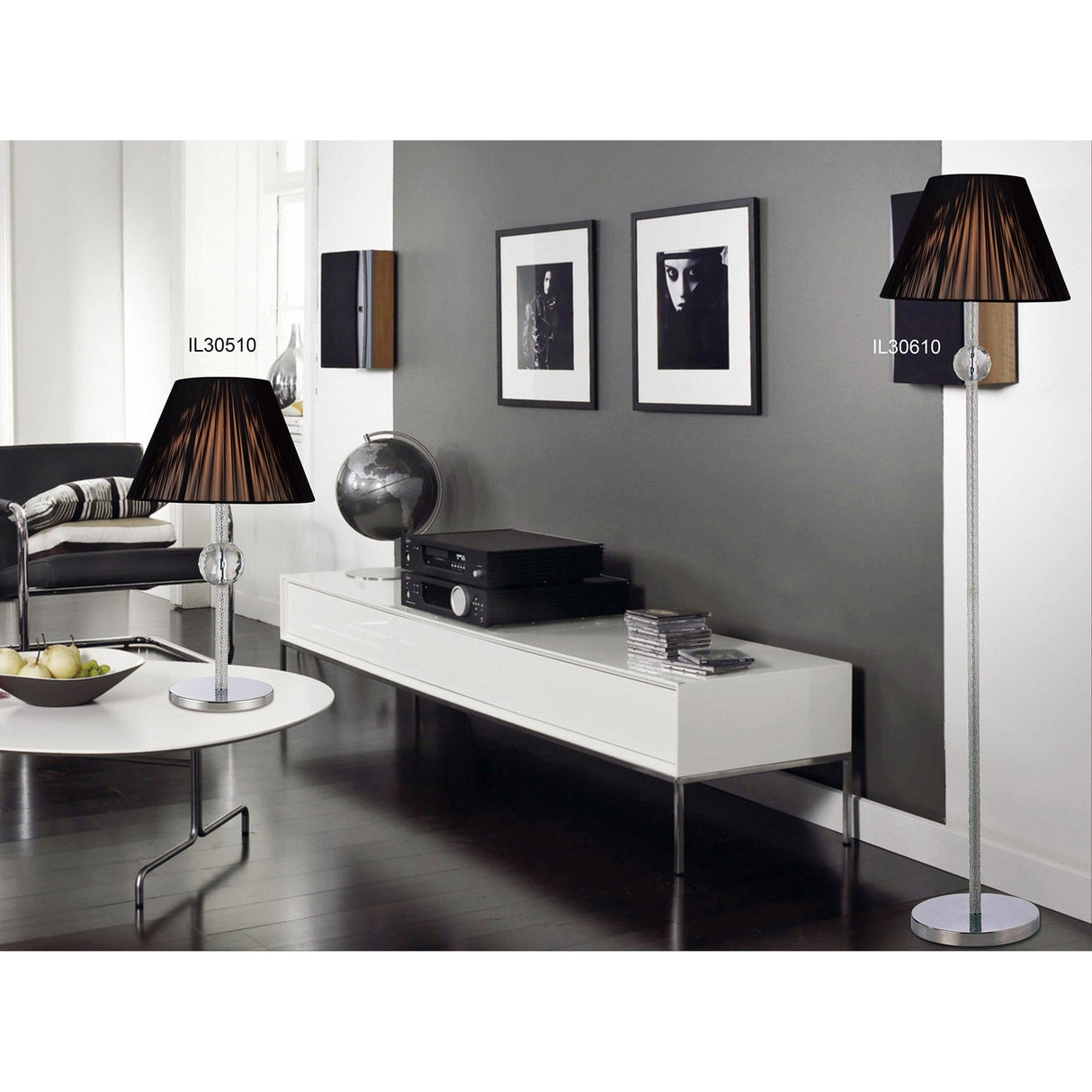 Modern living room with dark wood floors, a white coffee table, modern console for stereo equipment, black and white wall art, and two Elena 1 Light Crystal Table Lamps in chrome (without shade) for a polished look.