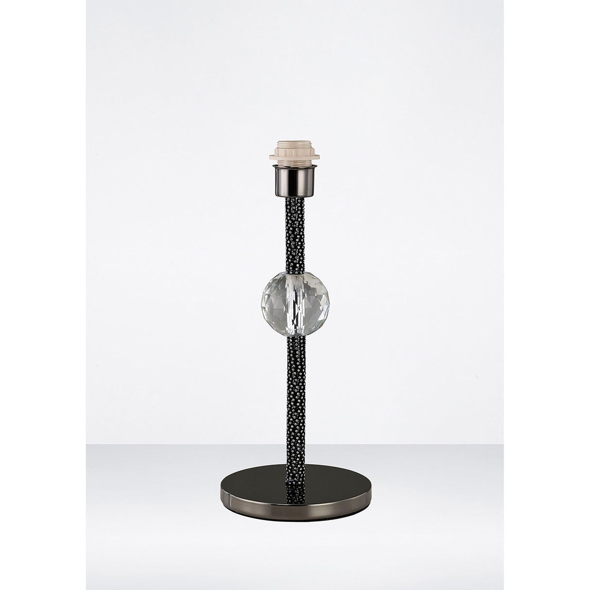 The Elena 1 Light Crystal Table Lamp - Black features a modern design with a round black base, textured black stem, and clear glass sphere detail. It has an exposed bulb socket and comes without a lampshade for a sleek, contemporary look.