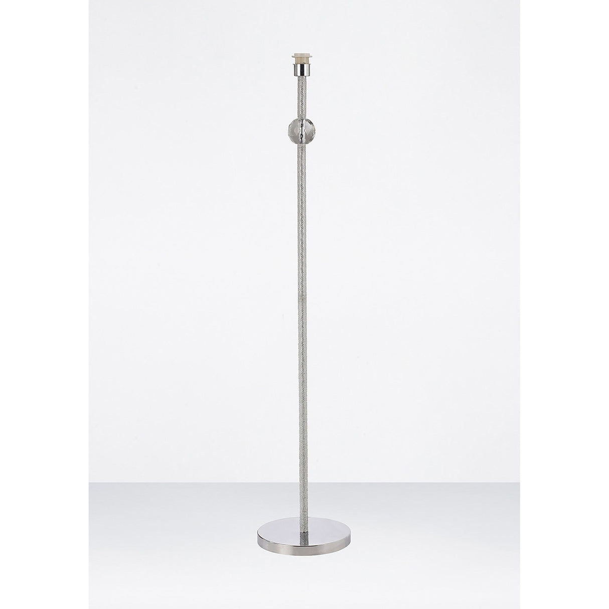 The Elena 1 Light Crystal Floor Lamp - Chrome (Without Shade) features a sleek, modern design with a brushed metal finish, round base, slim vertical pole, and crystal details—ideal for contemporary spaces. No shade or bulb is included.
