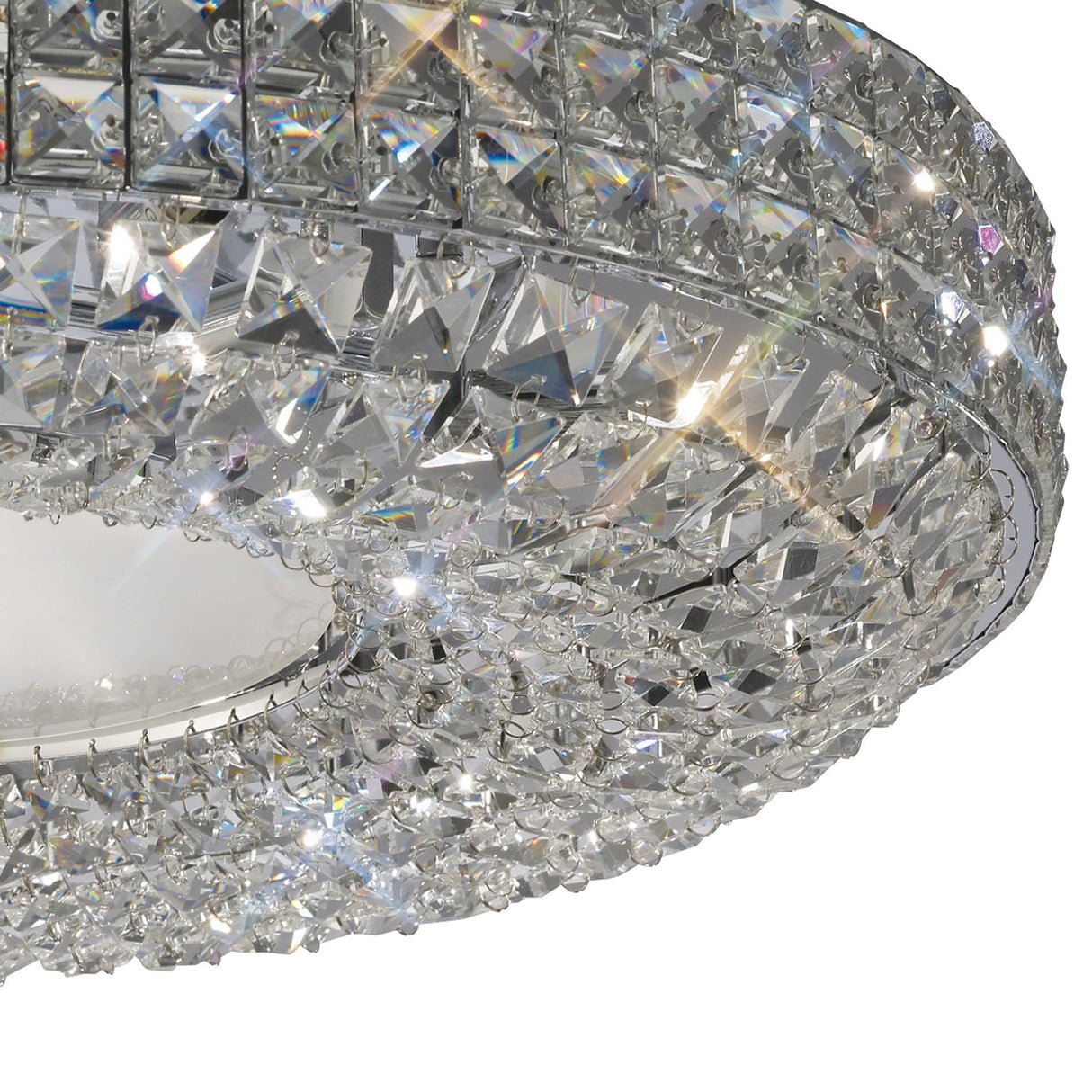 Close-up of the Diyas Enya 9 Light flush ceiling light showing layered Asfour cut crystal bands on a polished chrome frame with frosted white diffuser.