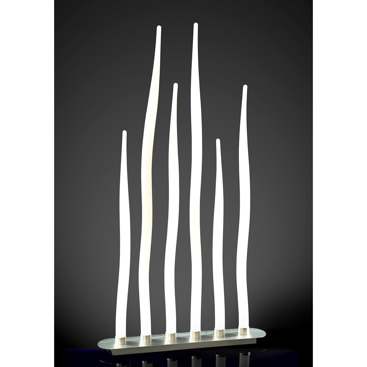 The Estalacta 6 Light Outdoor Floor Lamp in Silver & Opal White features six tall, wavy LED tubes of varying heights on a flat oval base—ideal for stylish, modern outdoor lighting.