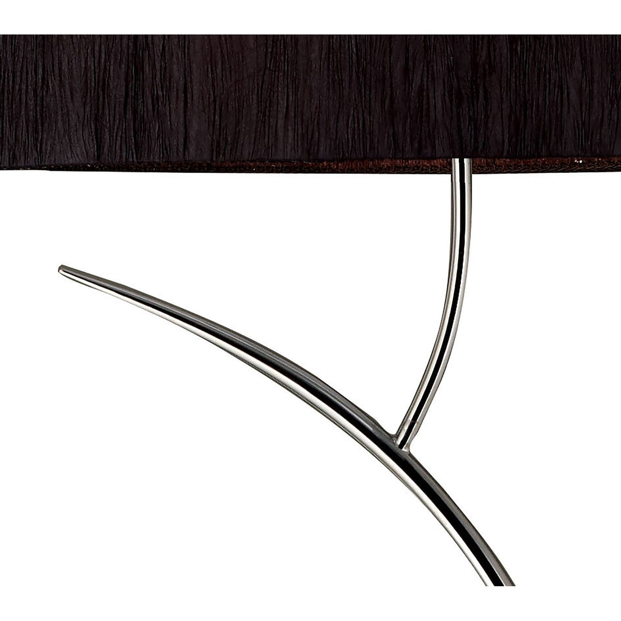 A close-up of a table with the Eve 2 Light Floor Lamp in chrome and a black oval shade in the background.