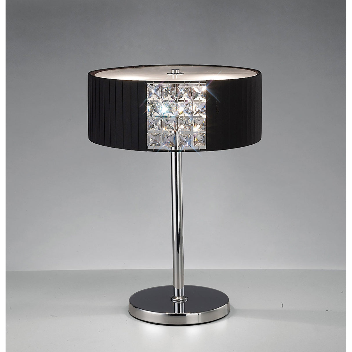 The Evelyn 2 Light Crystal Table Lamp features a sleek chrome stem and round base, a square section of crystal accents, and a modern black cylindrical shade, all set against a plain gray background.