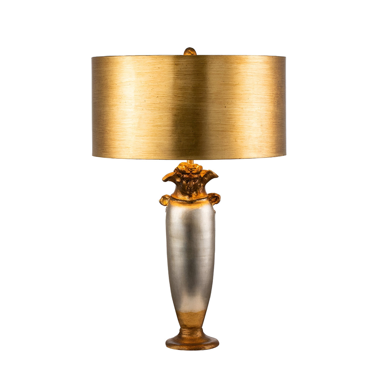 The Bienville 1 Light Table Lamp in Silver/Gold and Brown features a metallic body with a gold and silver finish, complemented by an ornate base and a wide, cylindrical gold lampshade. This design beautifully merges modern style with classical elements to create an elegant and sophisticated look.
