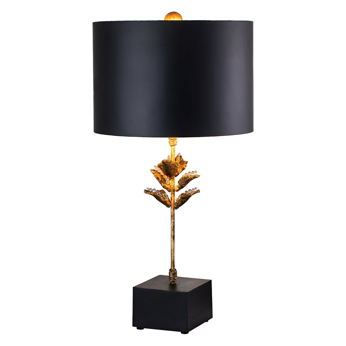 Introducing the Camilia 1 Light Table Lamp - Antique Gold & Black: a table lamp featuring a black drum shade and a gold stem designed like a stylized flower. With its black rectangular base, this elegant and modern piece includes a subtle gold leaf decorative element that enhances its allure.