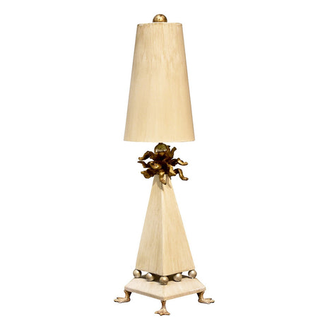 Introducing the Leda 1 Light Table Lamp, featuring a tall, ornate design with a triangular base. This lamp is enhanced by a luxurious cream patina and includes spherical details. It boasts a tapered lampshade resting on small feet and showcases intricate gold leaf embellishments near the shade for an elegant touch.