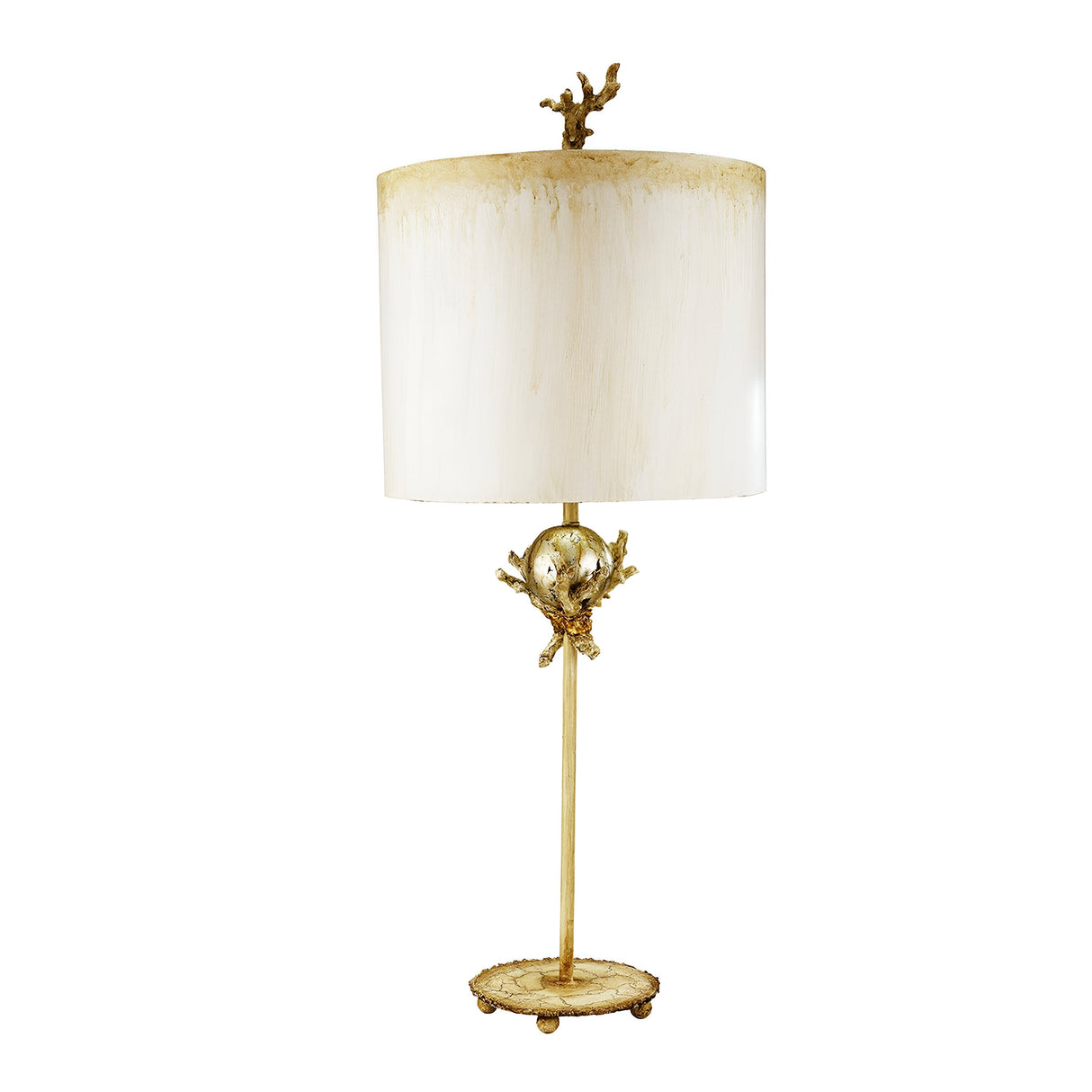 The Trellis 1 Light Table Lamp in Putty Patina & Silver Leaf is a decorative lighting piece featuring a white cylindrical shade and golden accents. It boasts an intricate base design with a round, reflective element and ornate details. This handcrafted lamp offers a simple yet sophisticated statement for any room.