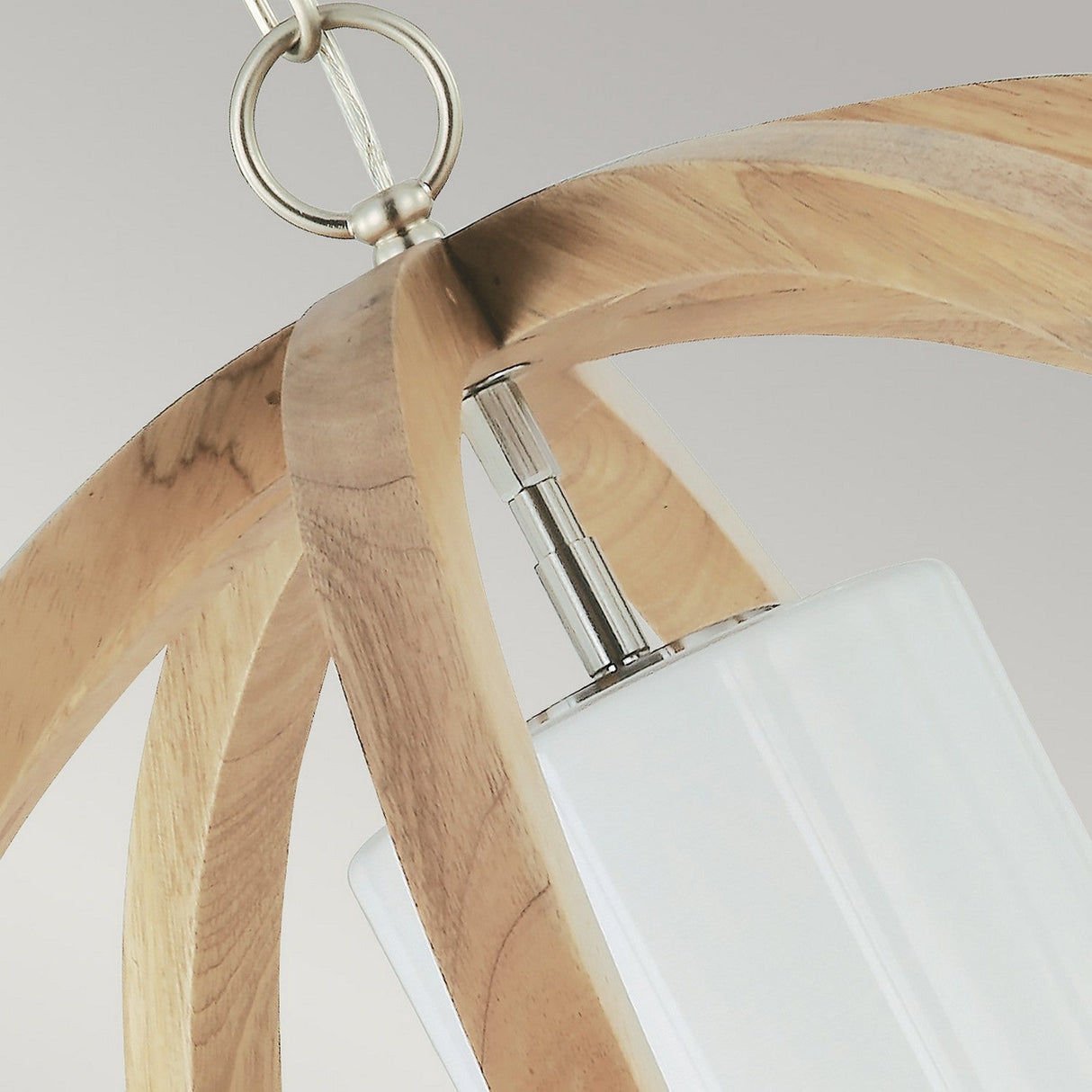 Close-up of the Allier 1 Light Large Pendant, showcasing a wooden frame with a light wood finish and a frosted glass shade. Brushed steel accents enhance the design, while the fixture hangs from a metallic chain against a light gray background.