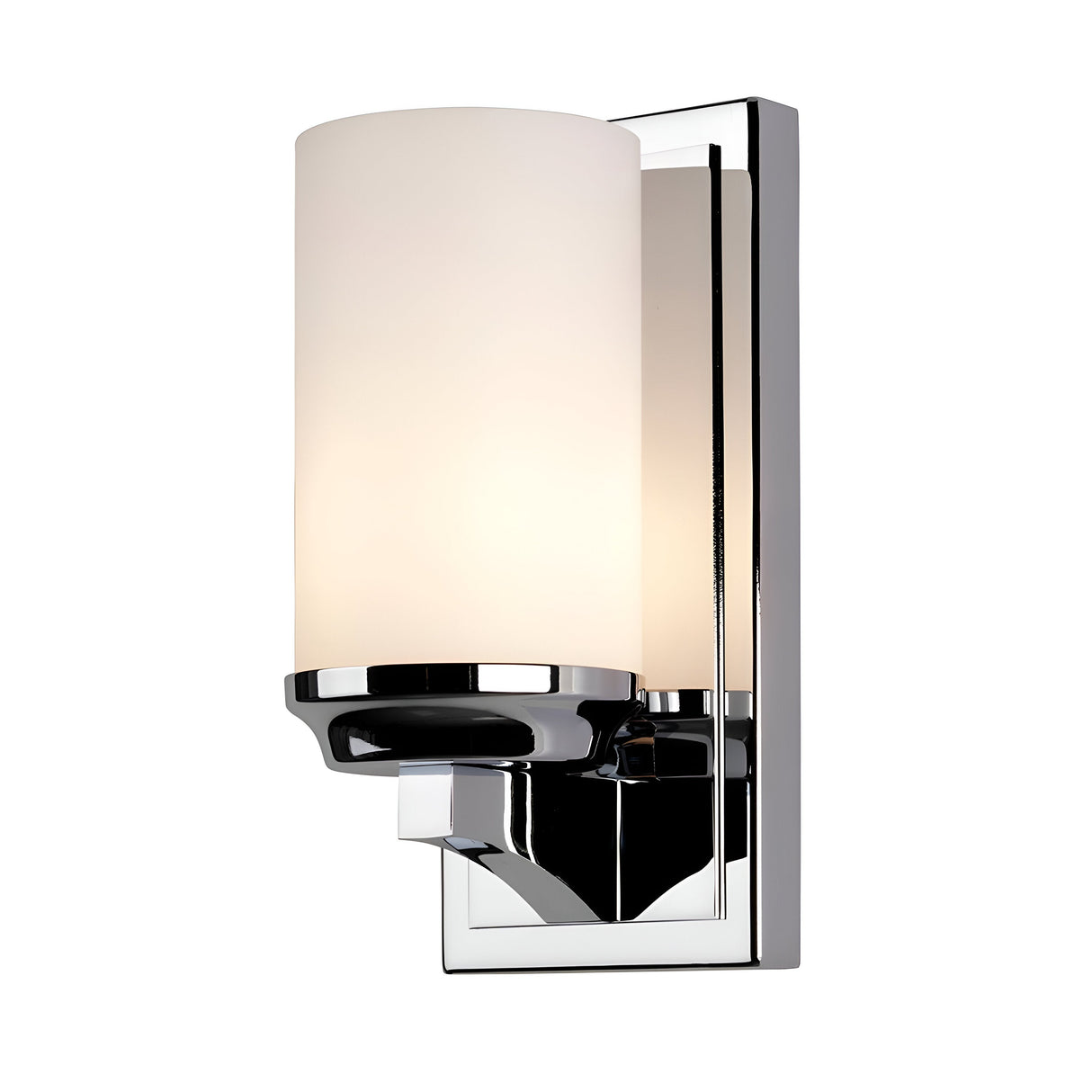 The Amalia 1 Light Small Wall Light features a polished chrome base paired with a cylindrical white opal etched glass shade. This bathroom lighting fixture emits a warm glow, making it ideal for a contemporary interior setting.