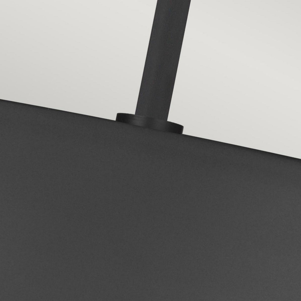 Close-up of the handle of an Asher 5 Light Pendant in Midnight Black & Gold, connected to the fixture, set against a neutral background, evoking an industrial-inspired design.