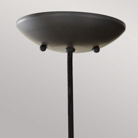 Close-up of the Beso 1 Light Mini Pendant in dark bronze, featuring a round, shallow dome design. This fixture, perfect for task lighting, is suspended from a cord against a plain, light gray background.