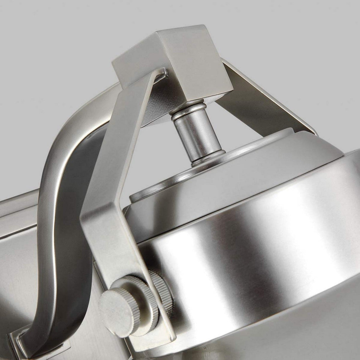 Close-up of the Boynton 1 Light Outdoor Medium Wall Lantern with a modern design, featuring an adjustable head and a smooth, painted brushed steel finish reminiscent of weather-resistant lanterns. This contemporary piece elegantly merges functionality with the subtle charm of nautical design.