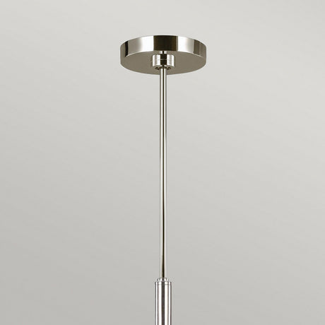 The Brianna 6 Light Chandelier in polished nickel showcases a sleek, minimalist design with a metallic circular base and a single straight rod, elegantly set against a plain gray background, epitomizing modern lighting.