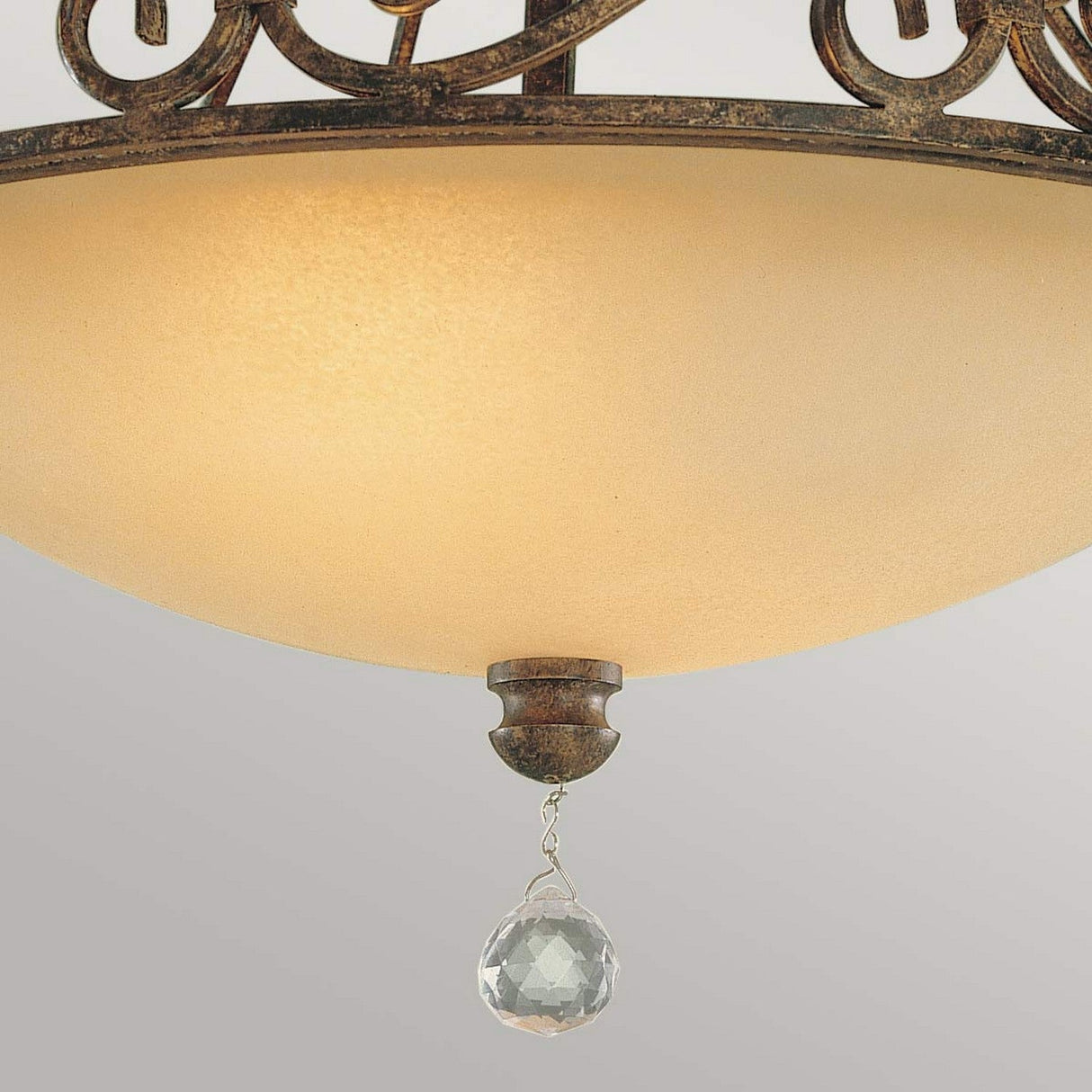The Chateau 2 Light Semi Flush in Mocha Bronze features a close-up view of its frosted glass shade, ornate metallic detailing, and sparkling crystal accents.