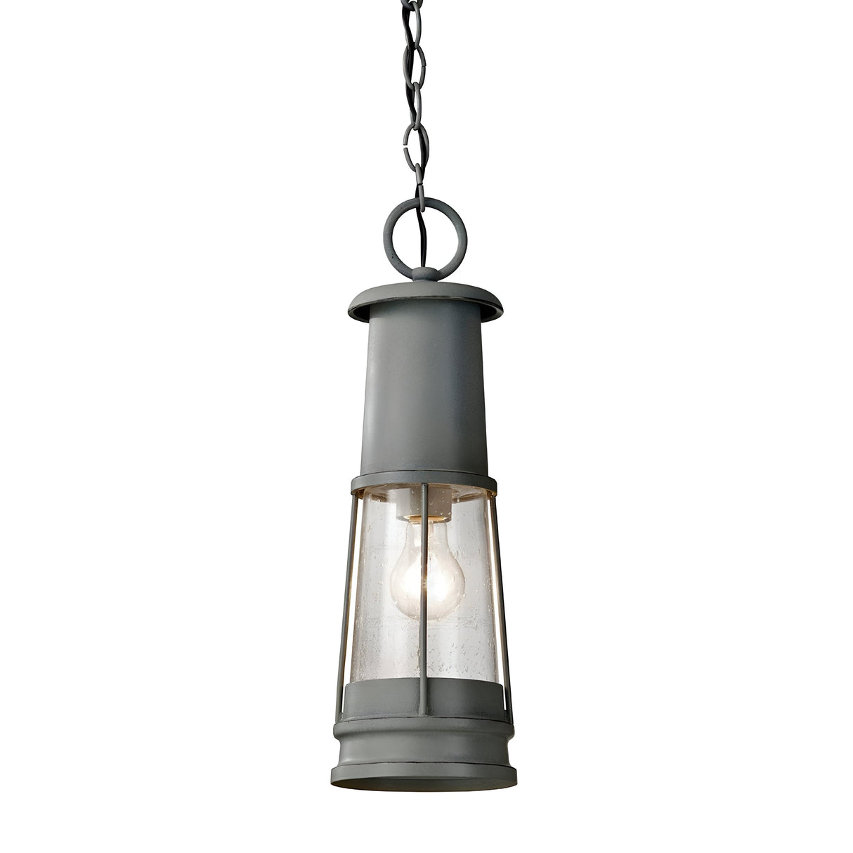 The Chelsea Harbor 1 Light Outdoor Chain Pendant - Storm Cloud is a vintage-style hanging lantern with an elongated metal frame and glass panels, showcasing a visible light bulb for added style. Suspended by a chain, it exudes coastal industrial charm, making it an ideal addition to any outdoor space.