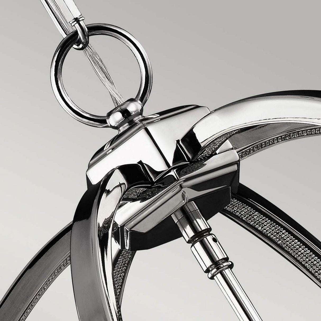 Close-up of the Corinne 3 Light Medium Chandelier showcasing its sleek, curved metal arms and central rod. The polished nickel finish beautifully reflects light, exuding a minimalist elegance against a neutral background for a stylish, contemporary appearance.