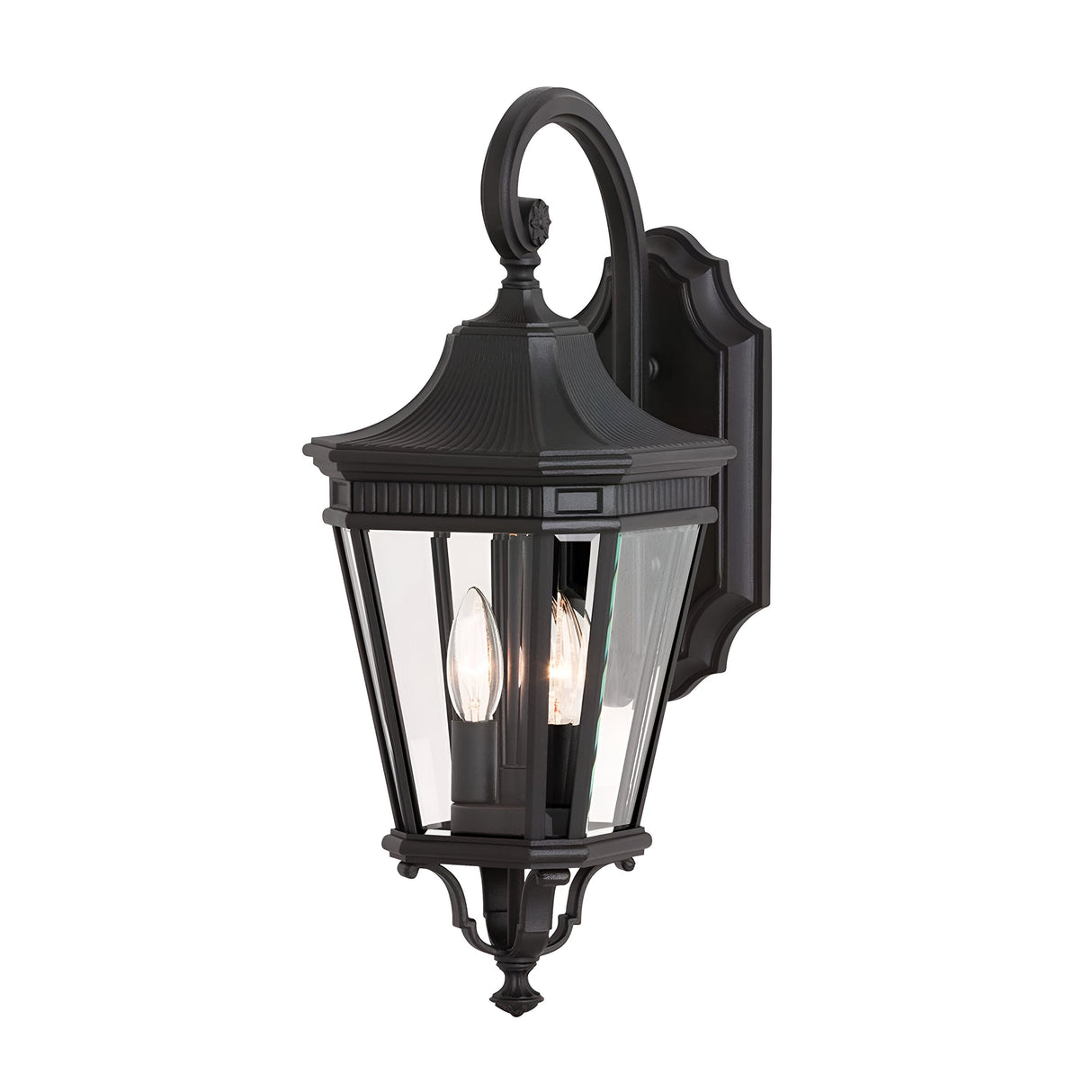 The Cotswold Lane 2 Light Outdoor Medium Wall Lantern in black boasts a classic style with a curved top and clear glass panels. It is equipped with two candle-like bulbs mounted on a decorative backplate, making it an elegant choice for illuminating and accentuating outdoor areas.