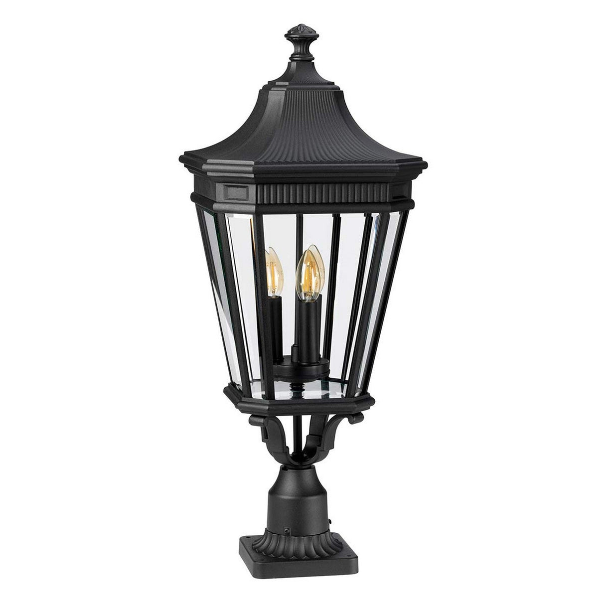 The Cotswold Lane 3 Light Outdoor Large Pedestal - Black boasts a black finish with a square base and four clear glass panels. It accommodates two candle-shaped bulbs and features a decorative top, making it an ideal choice for adding elegance to garden or pathway lighting.