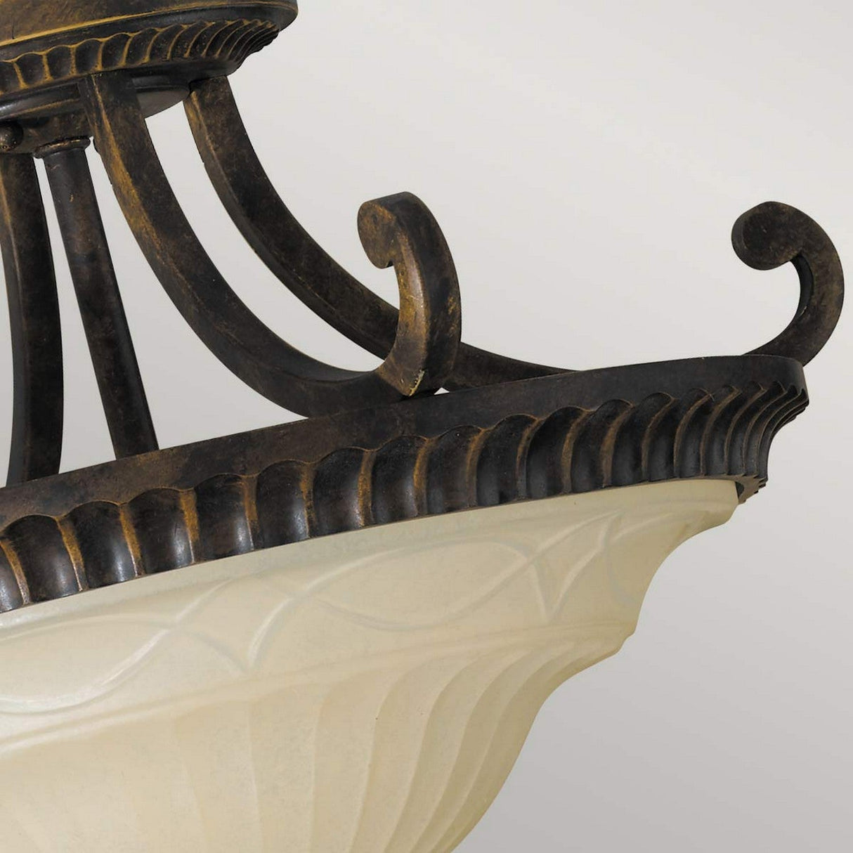 Close-up of the Drawing-2 Room 2 Light Semi-Flush fixture, showcasing a frosted glass bowl-shaped shade and intricate metal detailing in dark bronze. The fixture embodies Edwardian design influences with its graceful curved supports and textured rim design, all set against a neutral background.