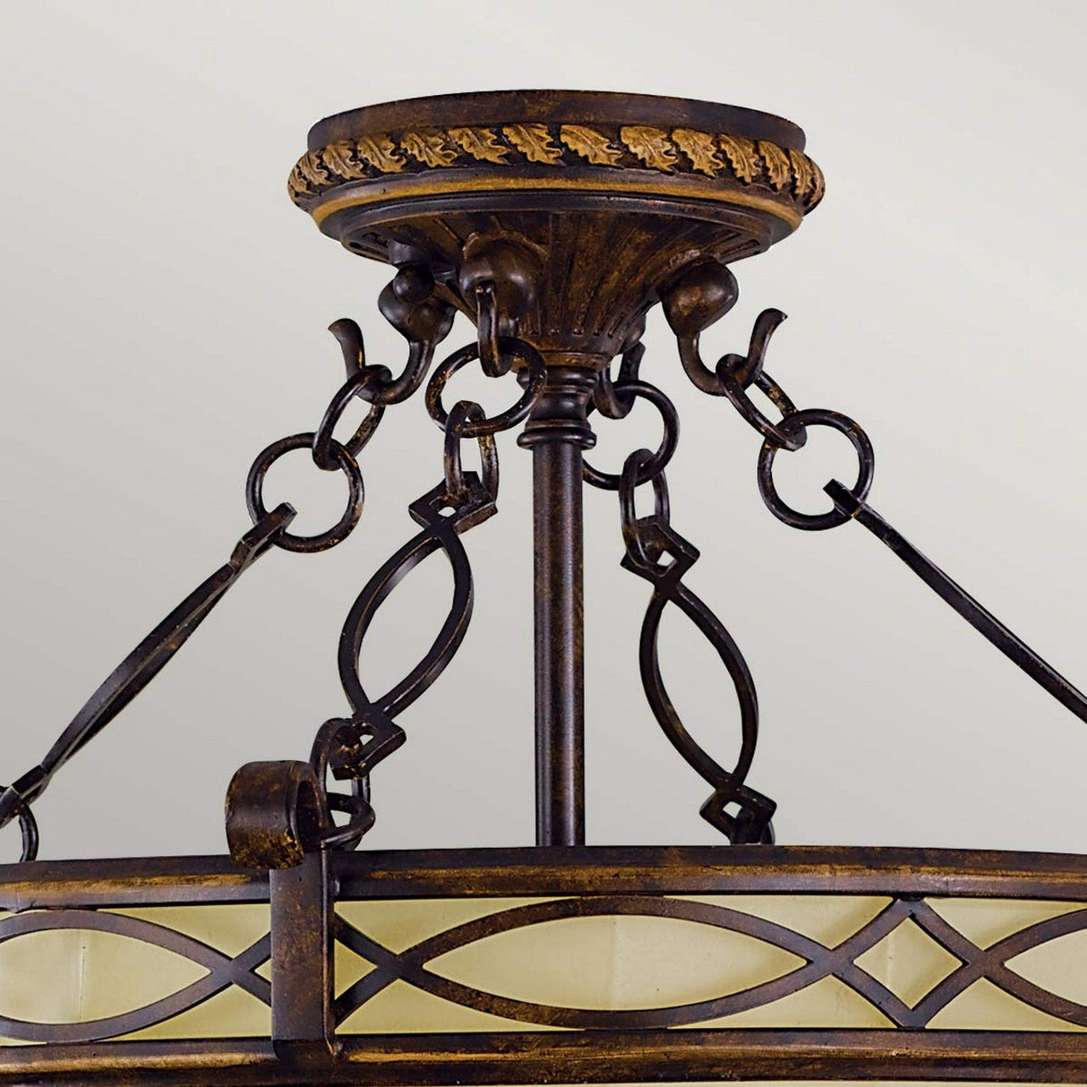 Close-up of the Drawing-3 Room 2 Light Semi Flush fixture in a walnut finish. It exudes Edwardian elegance, featuring intricate metalwork with decorative loops and detailed edging, hanging from a short rod. The light is softly diffused through a frosted glass shade.