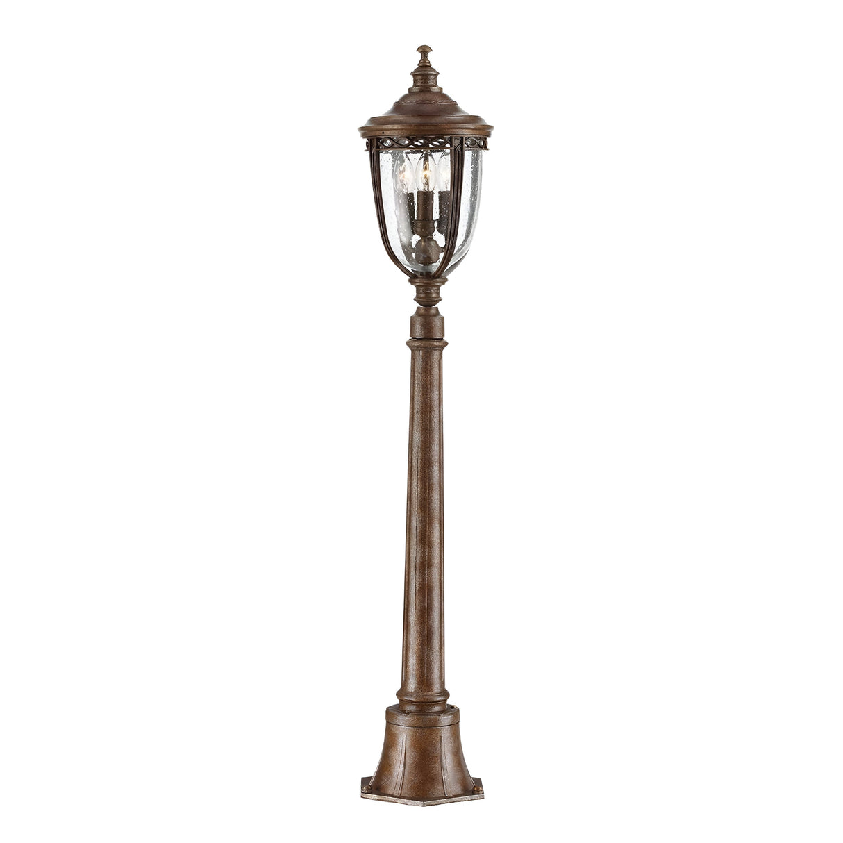 The English Bridle 3 Light Outdoor Medium Pillar Lantern - Bronze showcases a vintage style with a bronze finish, featuring tall cylindrical clear seeded glass enclosures atop a decorative pole, all elegantly positioned on a square base.