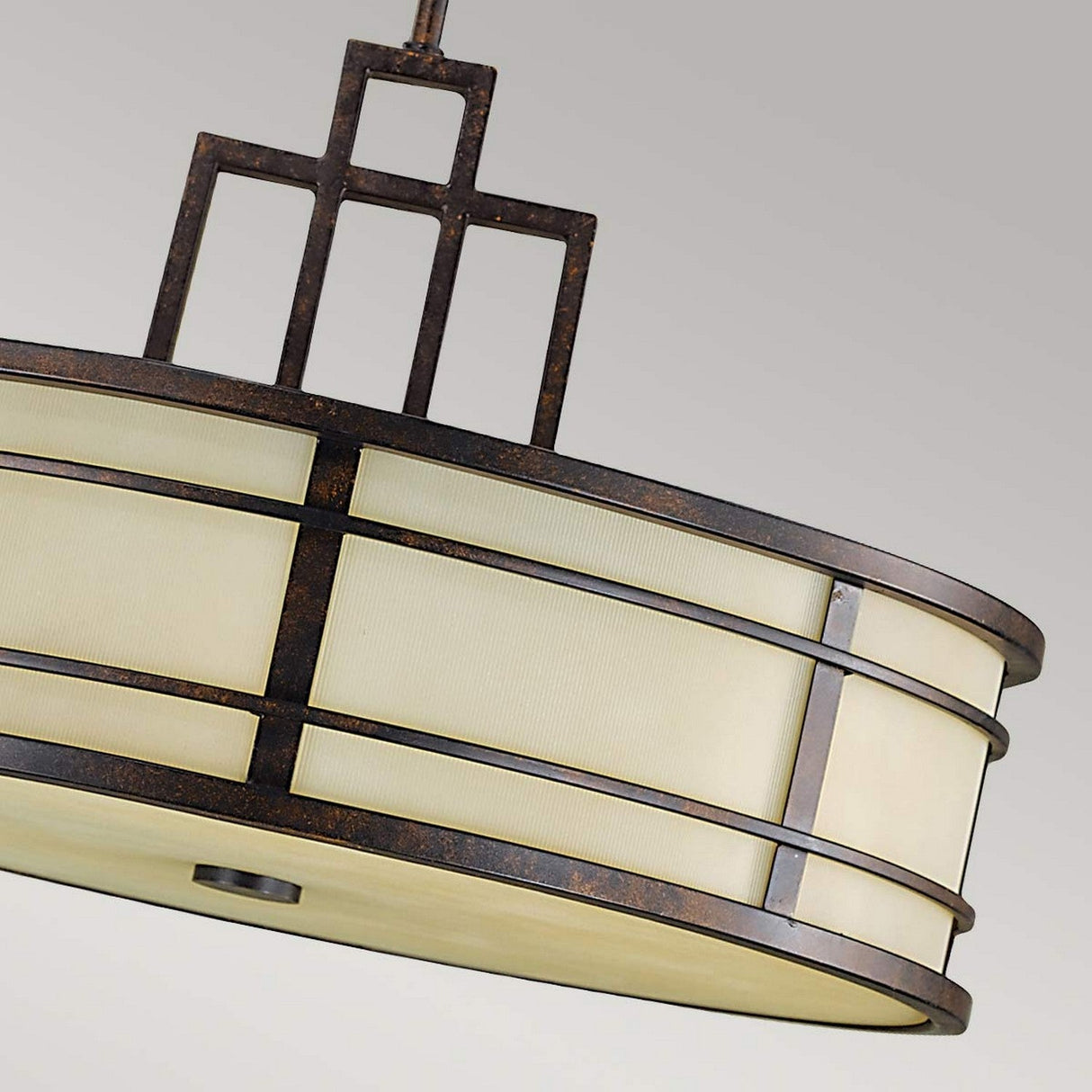 A close-up of the Fusion 3 Light Chandelier - Grecian Bronze showcases its circular, geometric design inspired by the Arts & Crafts movement, with frosted glass panels and a Grecian Bronze metal finish, set against a light gray background.