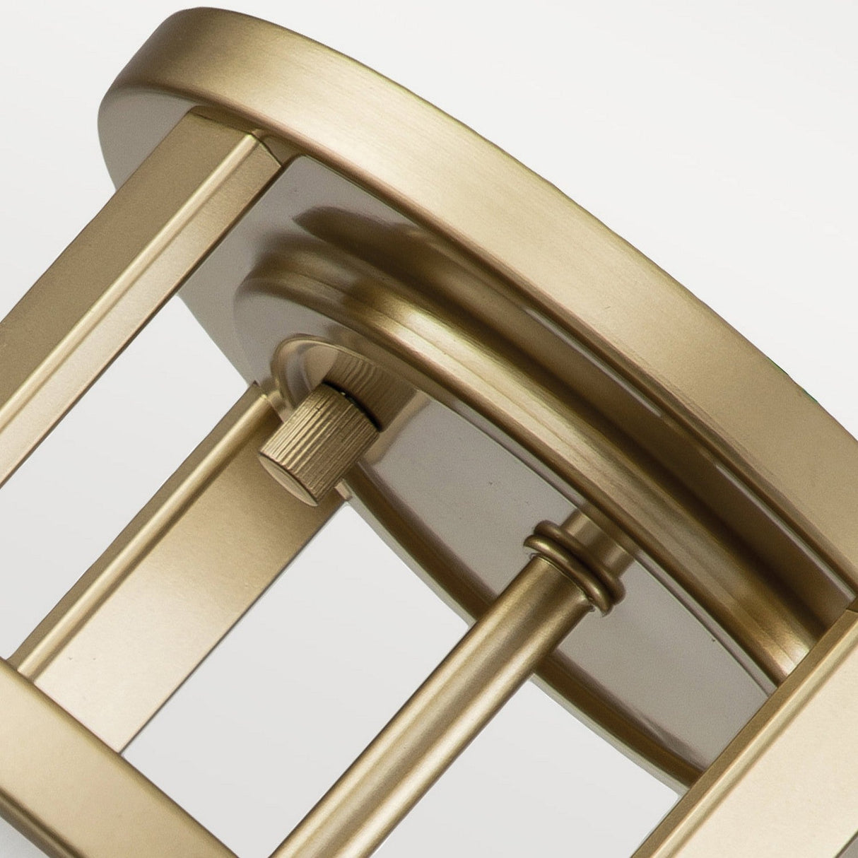 A close-up reveals the metallic gold-colored base of the Fusion 3 Light Semi Flush Lamp in painted natural brass, showcasing a round, flat top and an adjustable knob. Its sleek, modern design is characterized by strong lines and a smooth finish that perfectly complements the amber ribbed glass shade, creating a striking contrast against light, neutral backdrops.