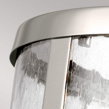 Close-up of the Harrow 1 Light Small Pendant in polished nickel, featuring a sleek metal frame and clear seeded glass. The light streams through the glass surface, creating a textured effect against a neutral, light-colored background.