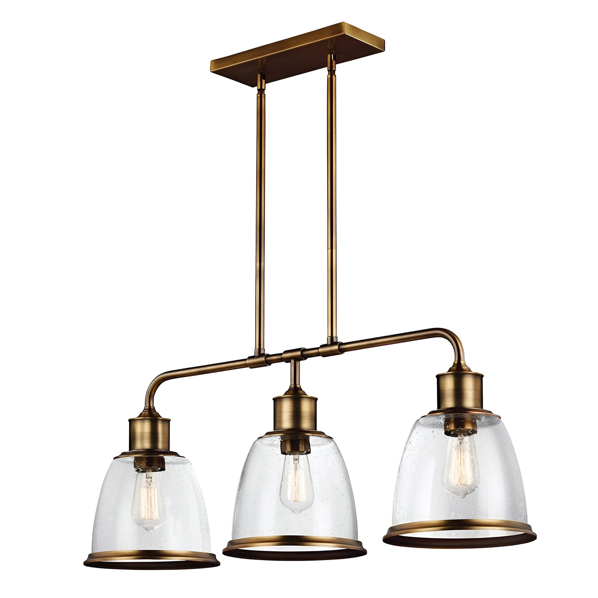 The Hobson 3 Light Island Light in Aged Brass showcases a contemporary design with three seeded glass dome shades, each gracefully enclosing an exposed bulb. This chic island light is suspended by two rods attached to a rectangular ceiling mount.