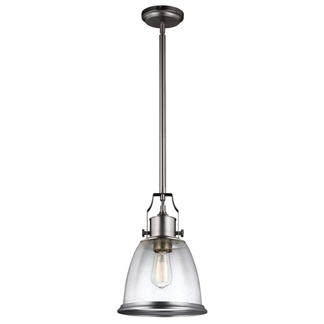 The Hobson 1 Light Medium Pendant in Satin Nickel elegantly hangs with a seeded glass shade suspended from a rod. Its visible bulb enhances the modern industrial aesthetic, making it an ideal industrial-inspired lighting solution.