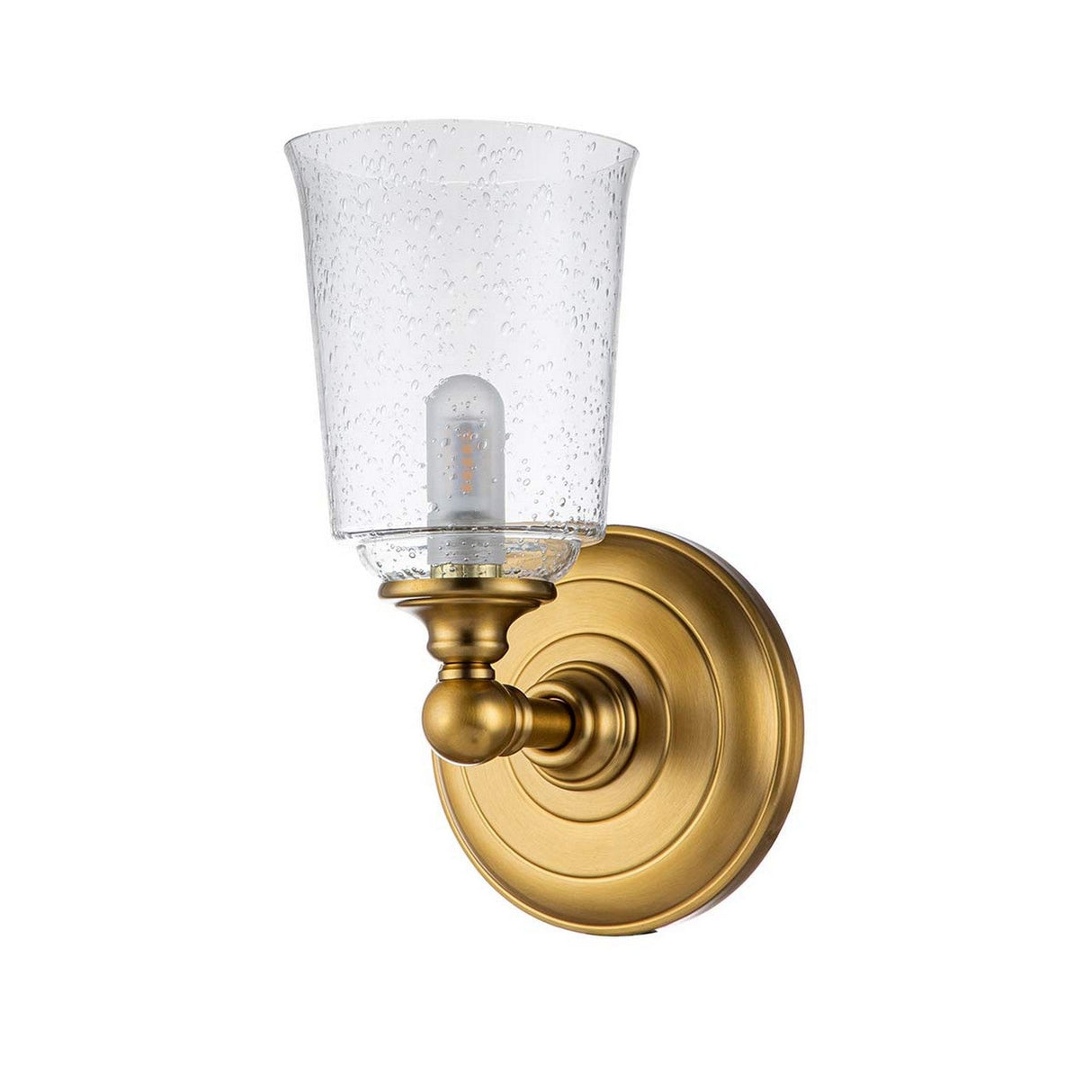 Introducing the Huguenot Lake 1 Light Wall Light - Burnished Brass: a sconce featuring a round backplate and an upward-facing fixture. It is adorned with a clear, seeded glass shade that encases a small bulb, offering classic elegance ideal for any home or office environment.