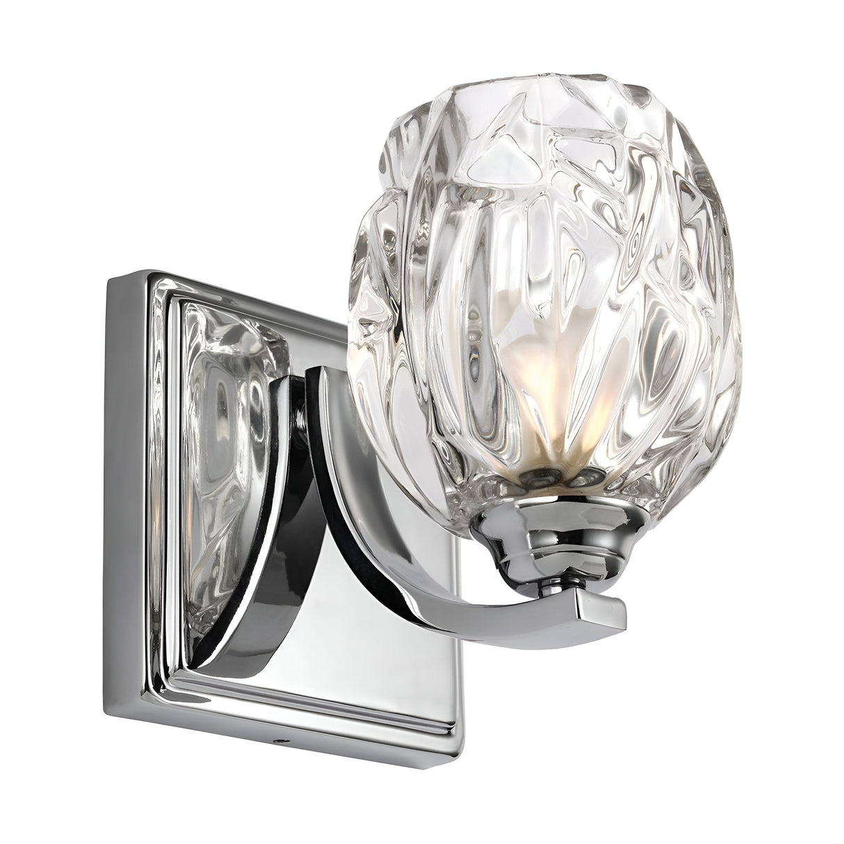The Kalli 1 Light Wall Light - Polished Chrome is a wall-mounted fixture with a polished chrome base and a decorative textured crystal glass shade, offering intricate patterns that provide an elegant and modern appearance.
