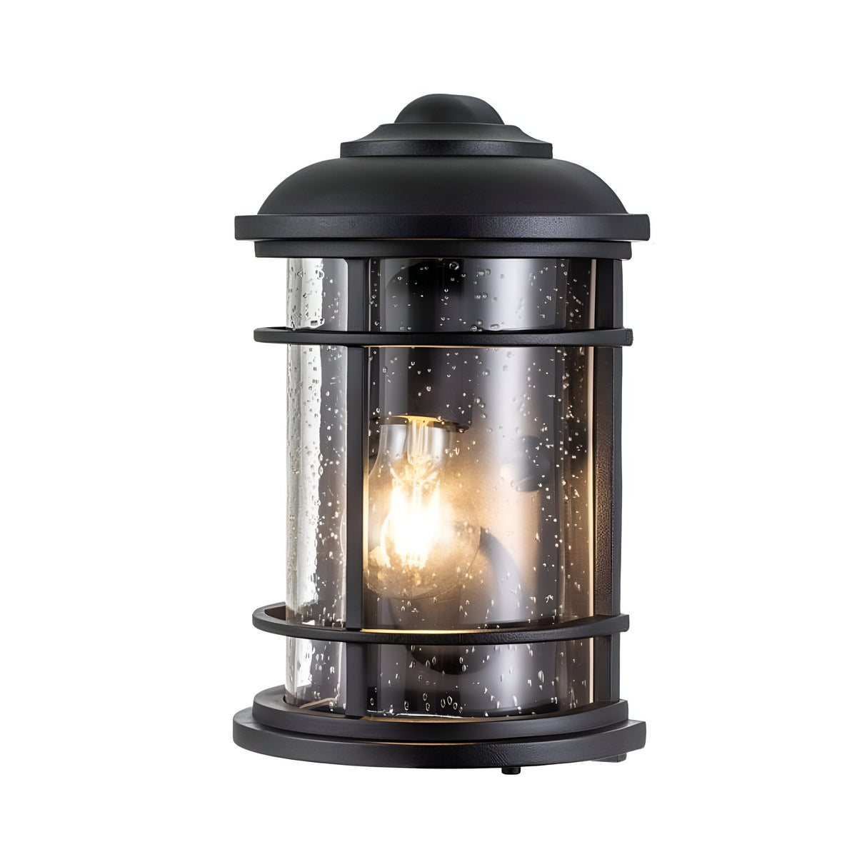 The Lighthouse 1 Light Outdoor Half Lantern - Textured Black is a cylindrical wall lantern with a design reminiscent of a coastal lighthouse. It features a clear glass shade and metal frame, and the visible interior bulb casts a warm glow, making it an ideal outdoor lighting solution.