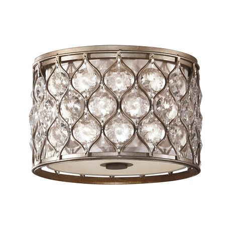 The Lucia 2 Light Flush - Burnished Silver is a circular ceiling light fixture with a decorative metal lattice design adorned with embedded Bauhinia crystals, finished in burnished silver for a vintage allure.