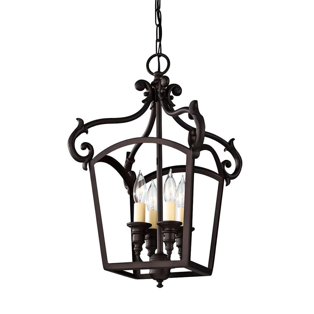 The Luminary 4 Light Chandelier in oil rubbed bronze elegantly suspends from a chain, featuring an ornate and symmetrical design. This lantern-style lighting fixture includes four candle-like bulbs encased within a classic lantern-shaped frame, epitomizing traditional design elegance.