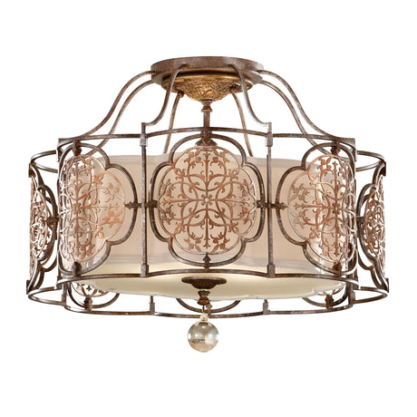 The Marcella 3 Light Semi Flush - Bronze ceiling light fixture exudes exotic elegance with its ornate bronze-finished metalwork. Intricate swirling patterns adorn the frosted glass cylindrical shade, complemented by a delicate spherical glass accent hanging below.
